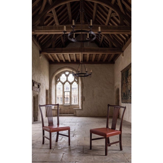 Pair of mahogany chairs designed by Helge Vestergaard Jensen for Peder Pedersen in the 1940s. Featuring an elegant,...