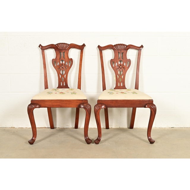 A gorgeous pair of Georgian or Chippendale style side chairs or dining chairs In the manner of Baker Furniture USA, Circa...