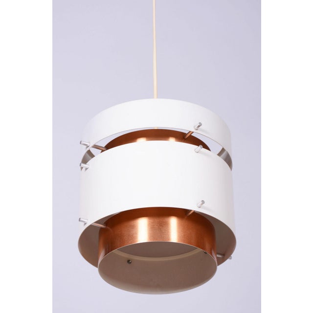 This design chandelier, created in the 1960s in Germany in the spirit of traditional GDR design, represents a magnificent...