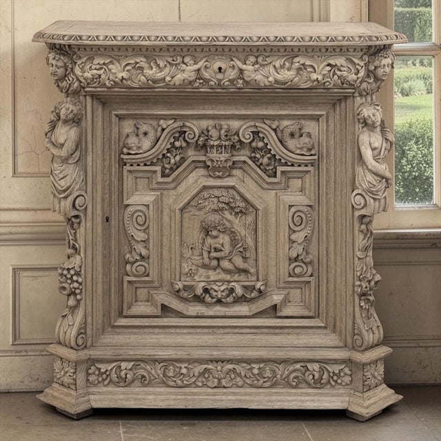 An extraordinary French Renaissance Revival buffet in stripped oak, distinguished by an exuberance of deep hand carving...