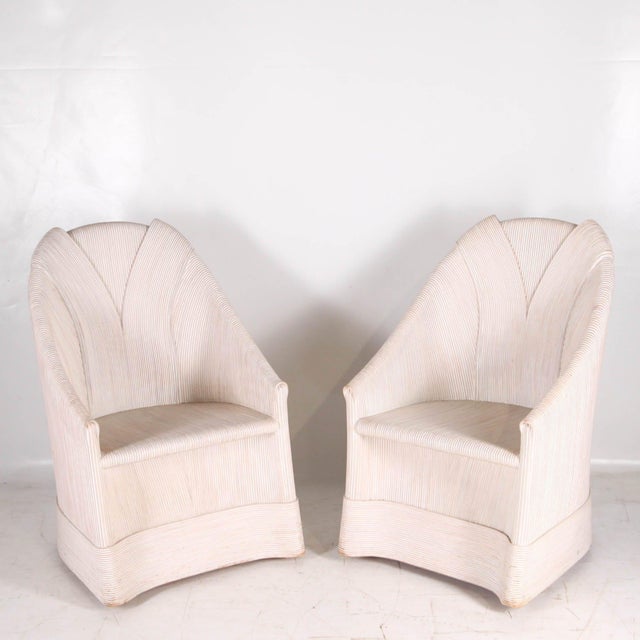 Rare pair of bleached rattan armchairs by Betty Cobonpue, circa 1970. A very characteristic piece by this renowned...
