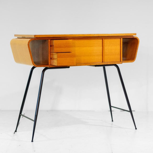 A rare 1960s Gio Ponti console table for Singer. Manufactured in Italy in the 1960s, the item is made of laquered oak wood...