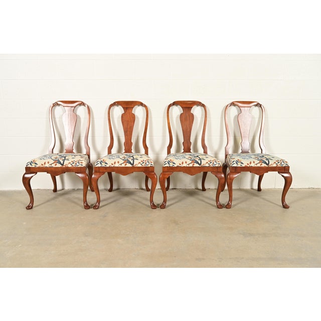 A gorgeous set of four Queen Anne or Georgian style dining chairs By Baker Furniture USA, Circa 1980s Solid carved walnut...