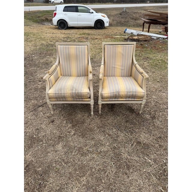 Large Pair of French Louis XVI Armchairs from France made of solid mahogany, the wood has been finished with a lustrous...