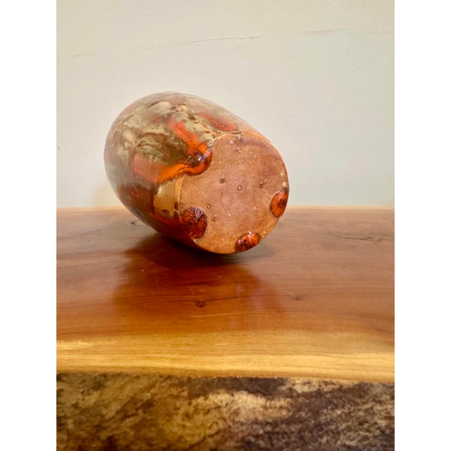 A beautifully expressive vintage studio pottery vase featuring a rich, high-gloss drip glaze in warm burnt orange, rust,...