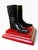 A charming object from England, made of iron and painted with a red base and black boots.