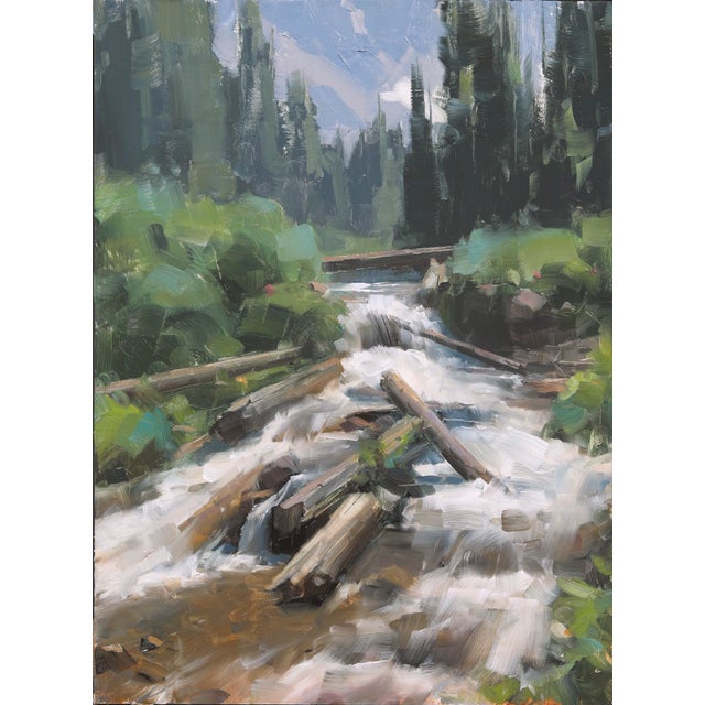 This oil painting captures a serene creek winding through a lush landscape, with logs partially submerged in the rushing...