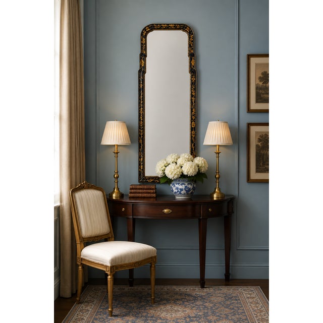 This is a black lacquer and gilt chinoiserie mirror. It is attributed to Friedman Brothers is the oldest mirror...