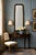 This is a black lacquer and gilt chinoiserie mirror. It is attributed to Friedman Brothers is the oldest mirror...