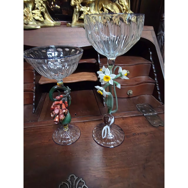 Two beautiful highly detailed botanical art glass drinking vessel sculptures. The shorter one is 8.75"h and 4.25"...