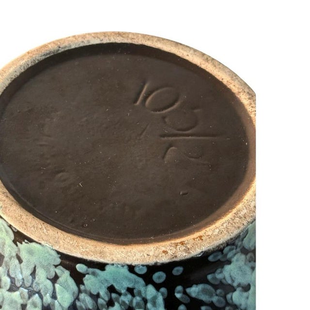 Ca. 1970, Western Germany made vase. Cool and clean design with a glazed inside. Marked at the bottom. Minor chip at the...