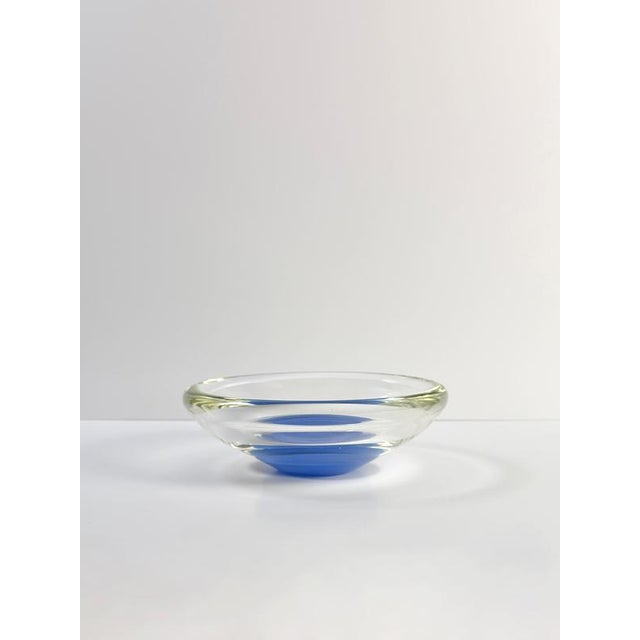 This Murano sommerso glass bowl was produced in Italy during the 1970s and presents a refined interpretation of one of the...