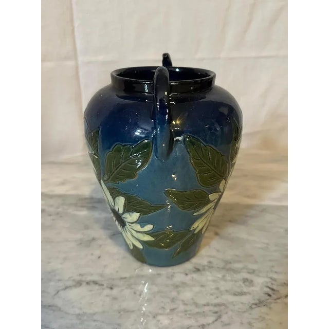 Beautiful glazed terracotta vase dating from the 1940s from Fauquet in Bonneville. Double handles. Decorated with white...