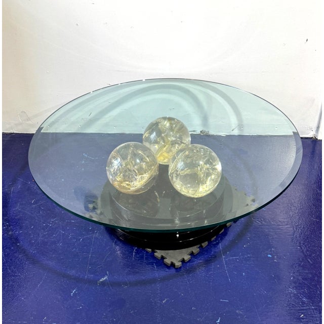 Beautiful vintage sculptural coffee table in the manner of Pierre Giraudon, featuring three heavy fractured clear resin...