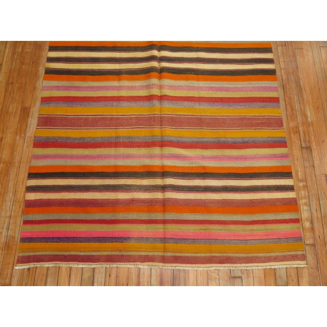 one of a kind hand-knotted turkish kilim with multiple colors on a striped band motif. Kilims, primarily refer to a type...