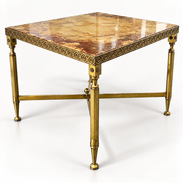 Symmetrical neoclassical design with decorative rosette frieze, square corner elements, conical/faceted legs and X-shaped...