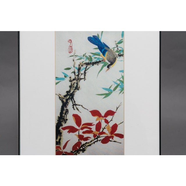 An original signed Chinese bird-and-flower painting depicting a colorful magpie with blue and yellow plumage perched on a...