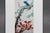 An original signed Chinese bird-and-flower painting depicting a colorful magpie with blue and yellow plumage perched on a...