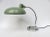 A rare table lamp or desk lamp from the 30s, the Bauhaus era in chrome with original paint in mint green. It represents a...