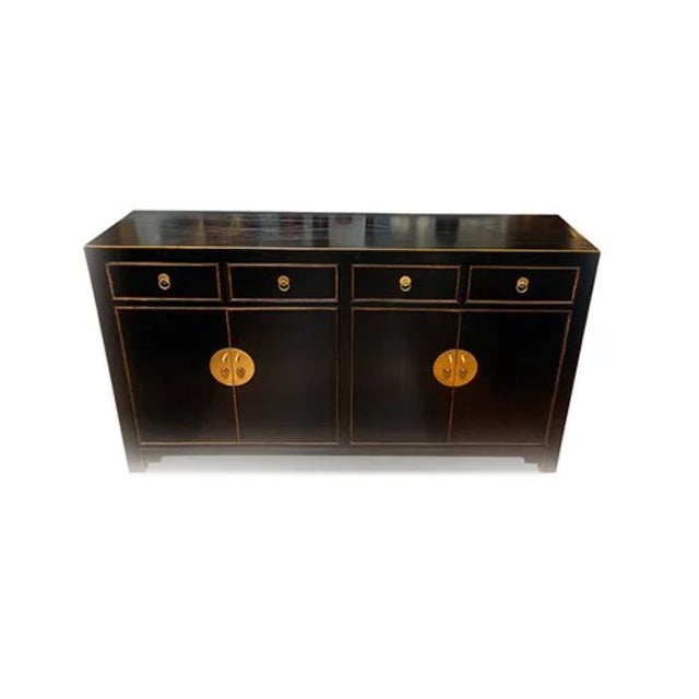 Asian East Village Sideboard is made out of Asian elm wood. It has 4 drawers and 4 doors with 1 removable shelf on each...