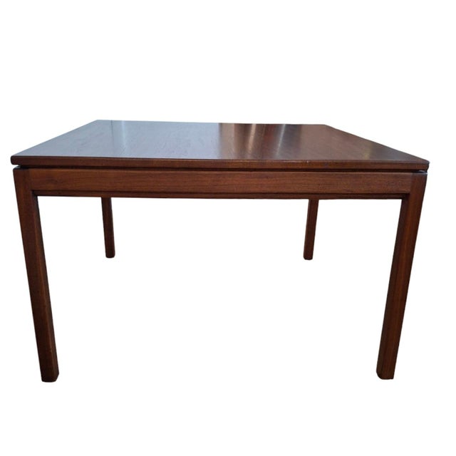 Classic mid-century coffee table by Danish-born designer Jens Risom. Composed of solid walnut wood, 32" W x 32" D x 20" H...
