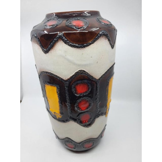 Standing 38 cm tall, this West German earthenware piece, renowned for its exquisite craftsmanship and rich history, is...