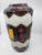 Standing 38 cm tall, this West German earthenware piece, renowned for its exquisite craftsmanship and rich history, is...