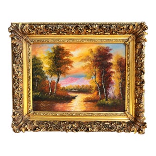 Ornate Landscape Painting – Golden Sunset Over a Lake With Sculpted Gold Leaf Frame For Sale