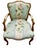 Ultra feminine fruitwood fauteuil with elegant curved lines, cabriole legs, and hand carved detail. High quality floral...