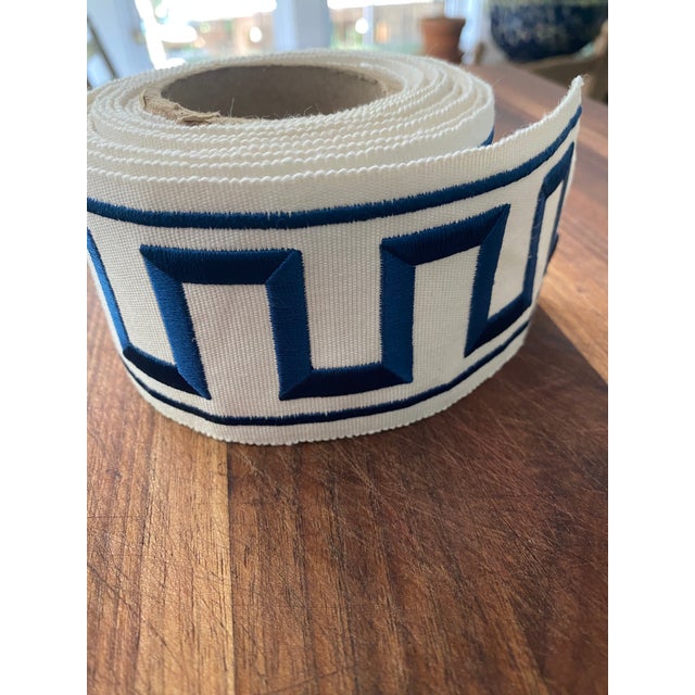 This quintessential Greek key motif feature clean lines in embroidered blue on an ivory ground. Tape trim is 2.25" wide;...
