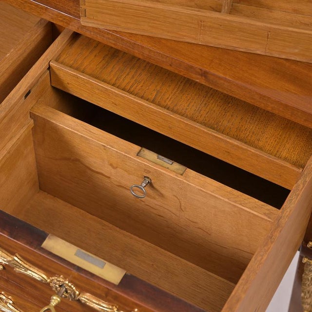 Desk, France, circa 1800 / 1810 Mahogany with gilded brass hardware; writing surface with original stamped leather; two...