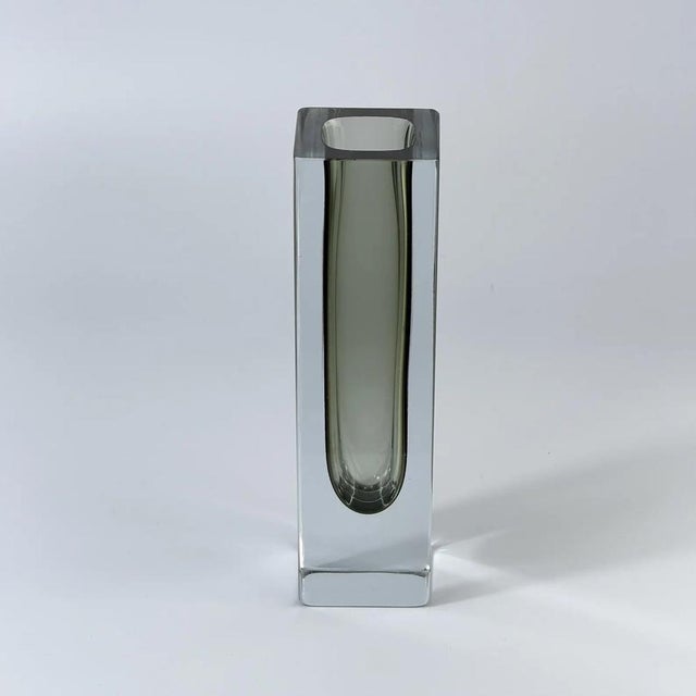 Elegant Murano glass vase attributed to Mandruzzato, Italy, circa 1970s. This sculptural piece is crafted in the classic...