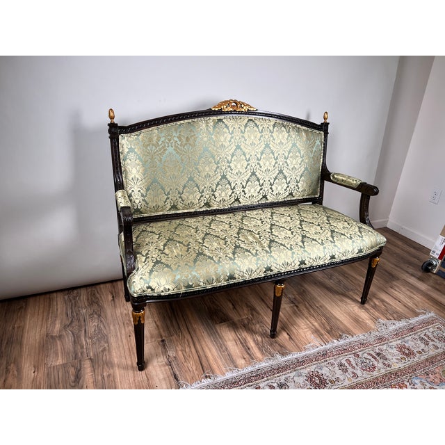 This elegant vintage Louis XVI style settee captures the refined symmetry and classical restraint associated with French...