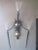 A large monumental theater sconce with wire basket shades in the style of Mathieu Mategot ,black metal horns and brass...