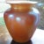 Durand Iridescent orange gold glass vase. With large beautiful proportions; this vase adds color and warmth to an...