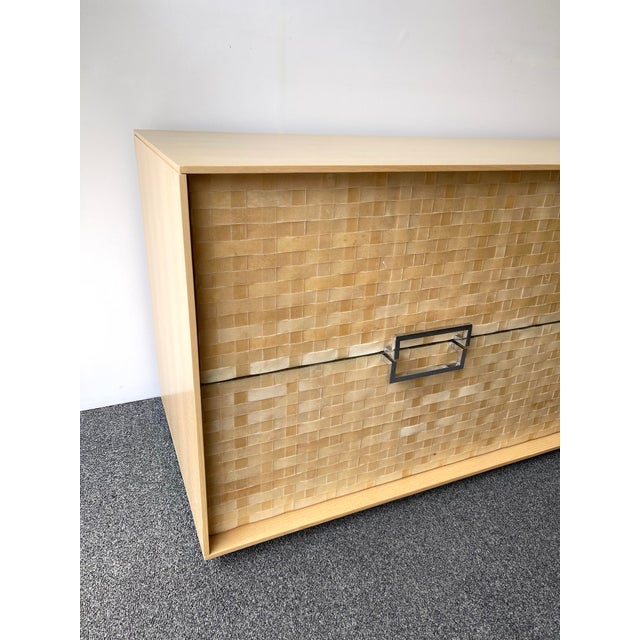 Chest of drawers, commode or dresser in wood and braid of very slim leather bands, metal chrome handle by the editor...