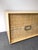 Chest of drawers, commode or dresser in wood and braid of very slim leather bands, metal chrome handle by the editor...