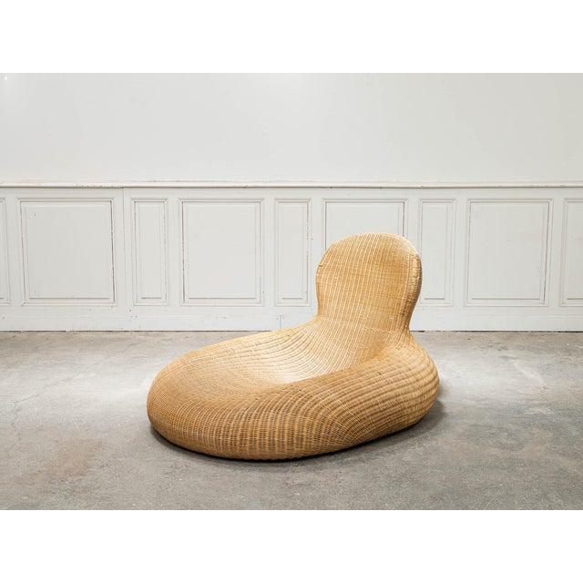 Rattan takes on a decidedly contemporary look here. Produced by IKEA in the 2000s, this large recliner chair captivates...