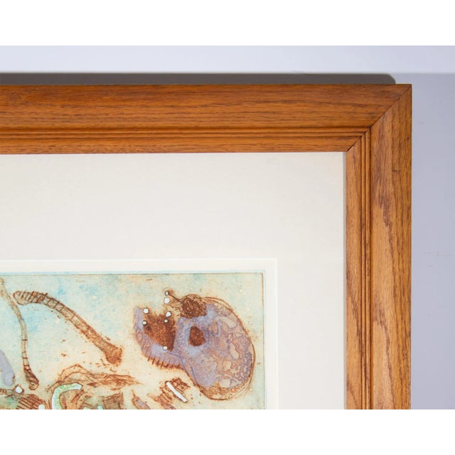 A hand-colored etching by Canadian artist Walter Sorge (1931-2021). Titled "Dancing Skeletons, Shall These Bones Live...