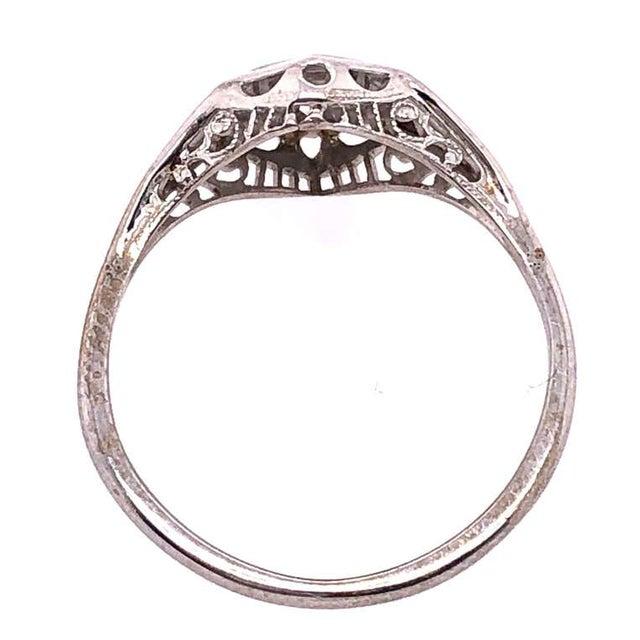 14 Karat White Gold Contemporary Ring with Round Diamond. Size 8 2.3 grams total weight.