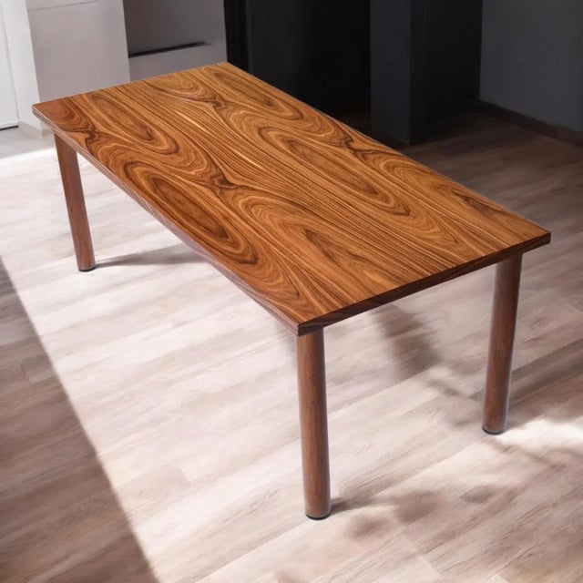 Modern minimalist rosewood dining table, vintage Nineteen-Laties (late 20th Century). This sleek dining table is all about...