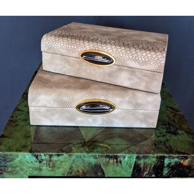 This stunningly gorgeous regency animal-friendly (faux) python covered decorative box is accented with an acrylic gemstone...
