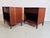 An exceptional pair of Mid-Century Modern walnut nightstands with a single top draw and open storage below. --- a perfect...