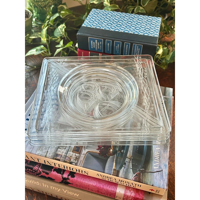 These Art Deco glass plates were produced by Heisey from 1934 - 1941. They are rectangular and have an etched design...