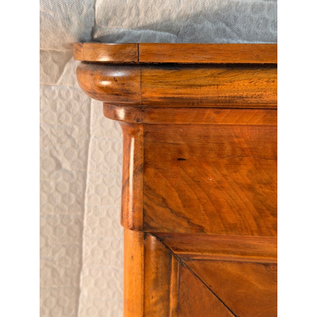 Biedermeier Walnut Wall Mirror, Austria, circa 1820 This elegant Biedermeier wall mirror embodies the restrained...