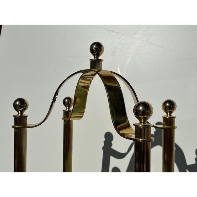 Pair of reeded columnar brass and frosted glass Illuminated etageres. Clearance between shelves starting from bottom are...