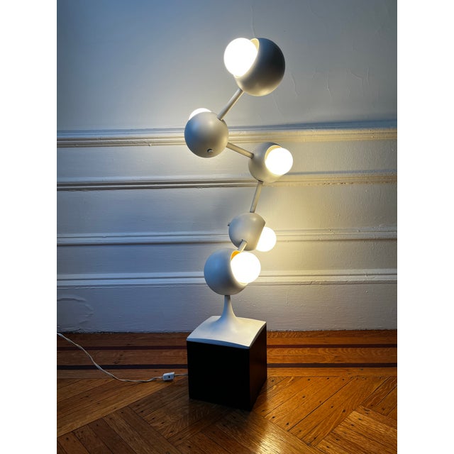 The design reflects the period's interest in modular, kinetic forms and space-age aesthetics. All five sockets...