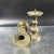 A lovely matching pair of Chinese bronze pricket candlesticks. Each candlestick features tiered gourd-form stems, a wide...