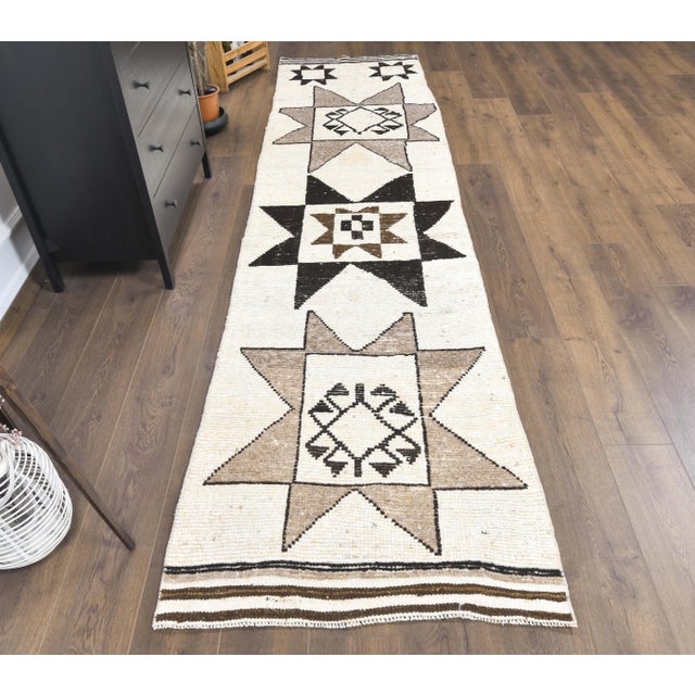 Vintage Turkish Hand-Knotted Herki Runner Rug is a semi-Vintage rug. '60s Eastern region of Turkey's unique rug is...