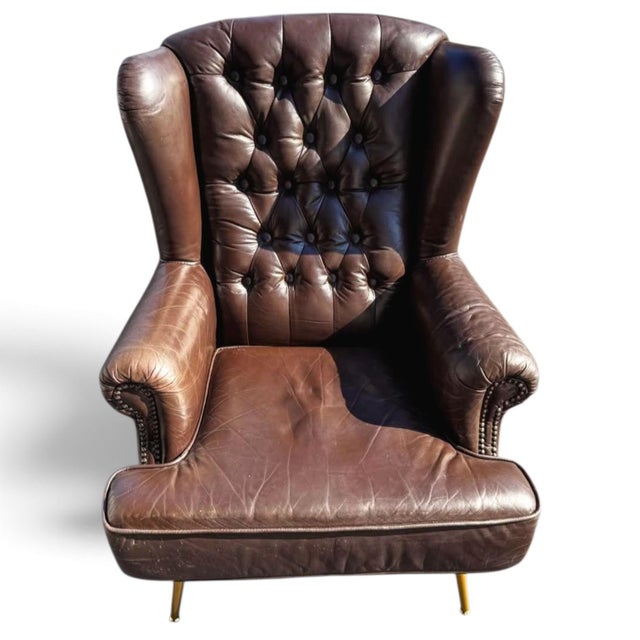 The Epitome of Mid-Century Prestige: Rare Vintage Rubelli Leather Wingback Chair Introduce an extraordinary statement of...